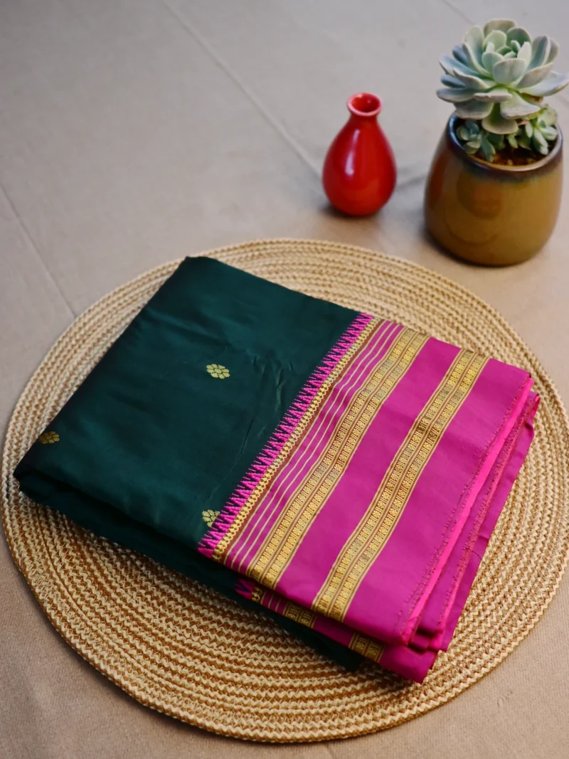 Dark green pure silk Narayan Peth saree with magenta border.