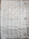 Pallu of golden white tissue silk saree