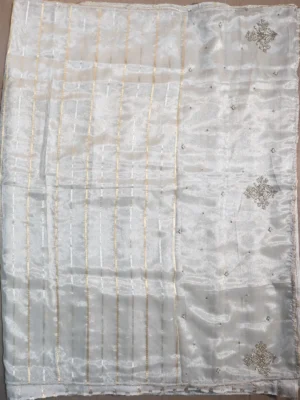 Pallu of golden white tissue silk saree