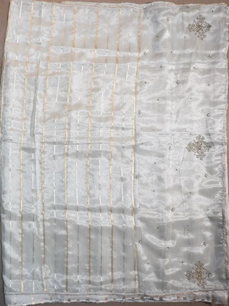 Pallu of golden white tissue silk saree