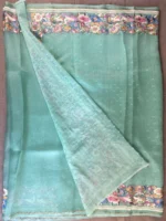 Blouse of light green organza with embroidery