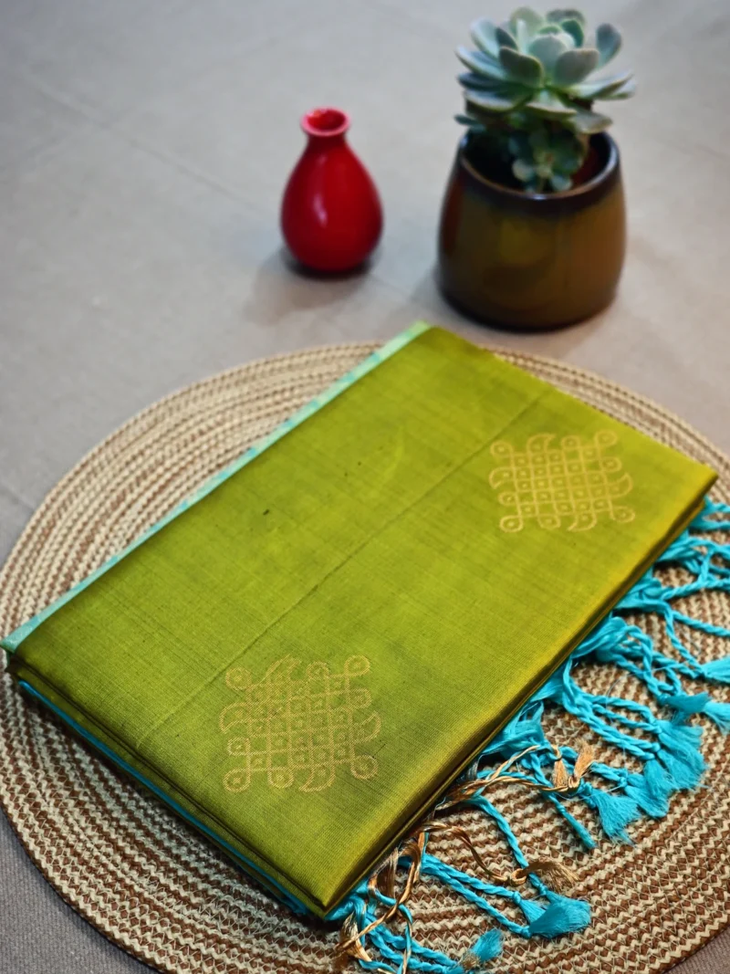 Olive green pure silk saree with kolam motif