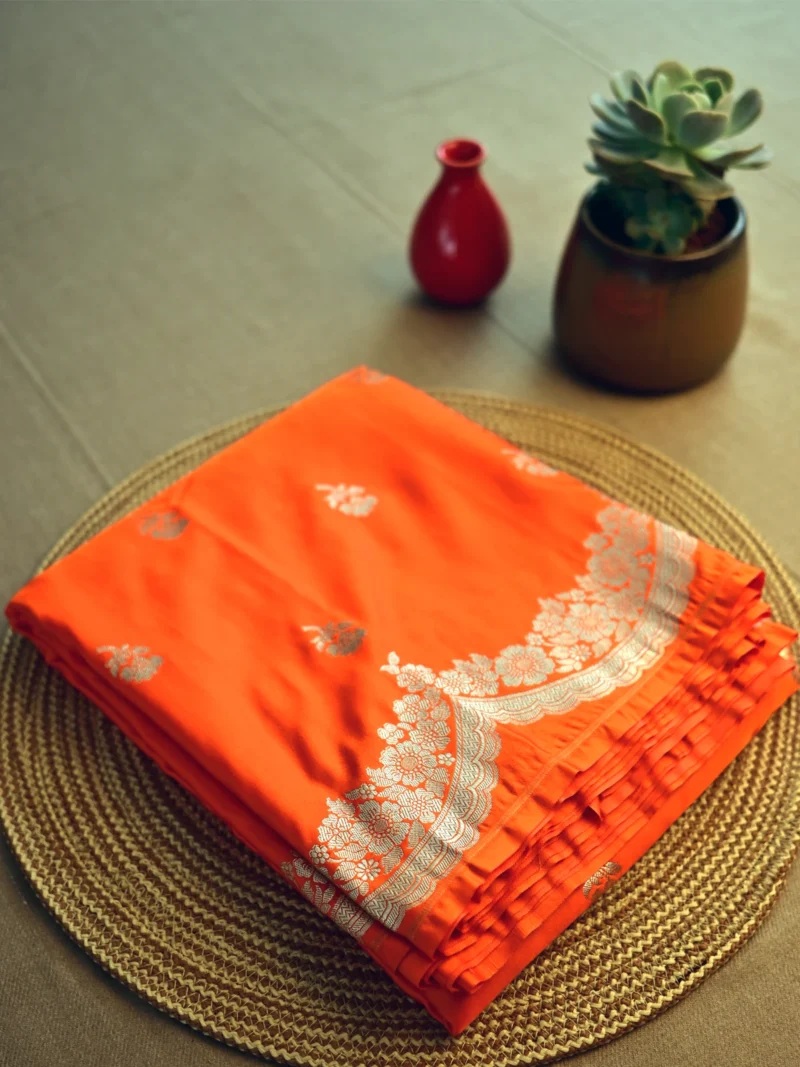 Orange Mashru silk saree with golden butti and border
