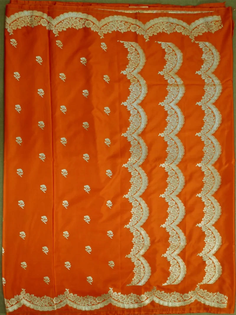 Pallu of orange Mashru silk saree with golden border