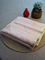 Peach colour Kota cotton saree with applique work.
