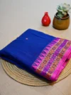 Blue Dongri Khadi cotton saree with pink border.