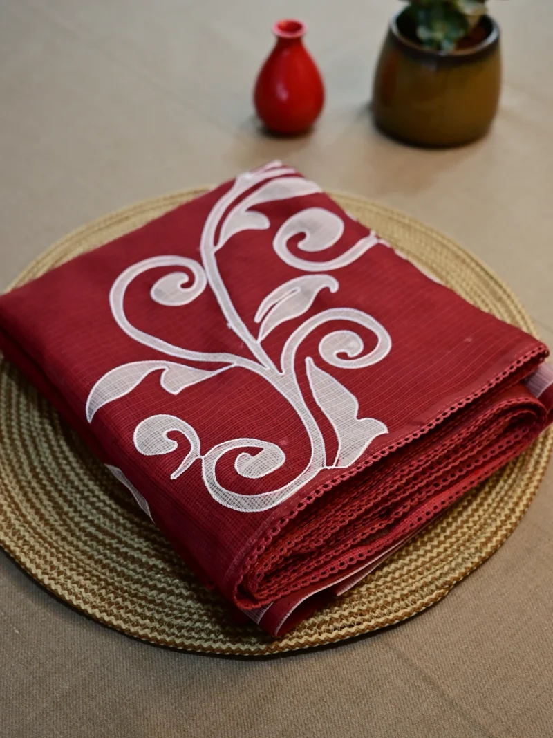 Brick red Kota cotton saree with thread work.