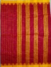 Pallu of brown cotton saree with yellow bprder.