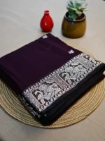 Dark brown cotton Baluchari saree with white border.