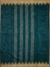 Pallu of dark green cotton saree with beige border