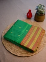 Green pure silk Narayan Peth saree with orange border.