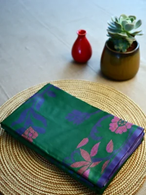 Green Jamdani print silk cotton saree.