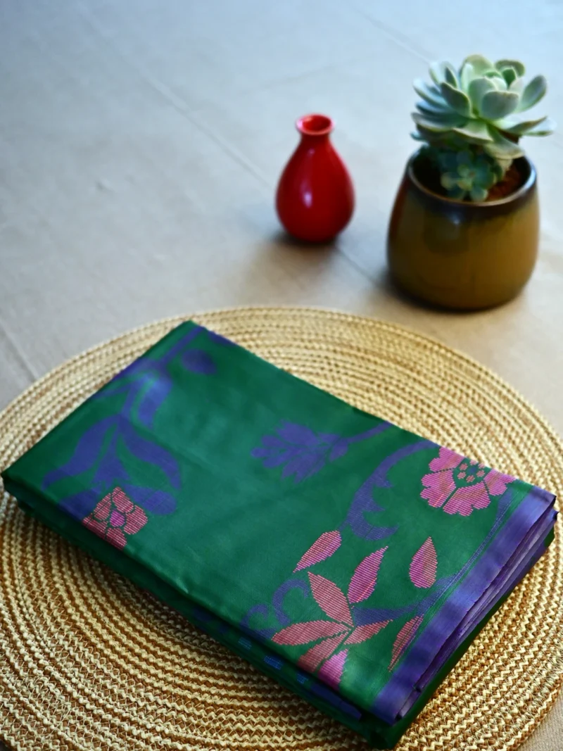 Green Jamdani print silk cotton saree.