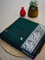 Green cotton Baluchari saree with white border.
