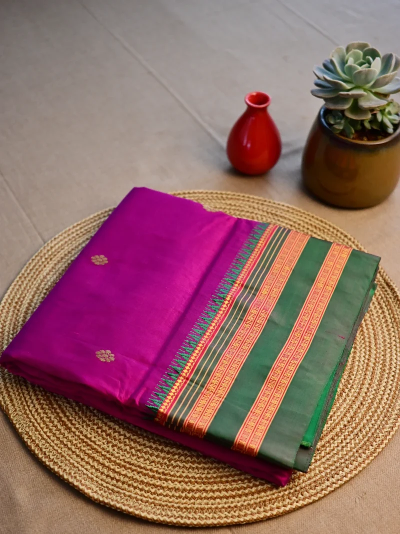 Magenta pure silk Narayan Peth saree with green border.