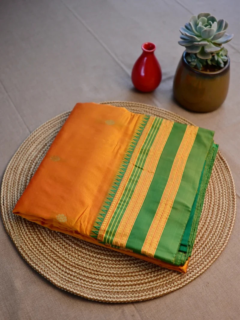 Mango yellow pure silk Narayan Peth saree with green border.