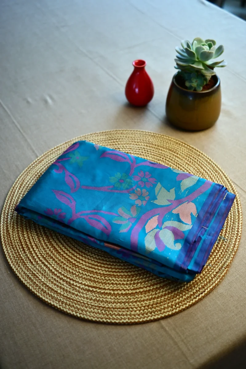 Peacock blue Jamdani print silk cotton saree.