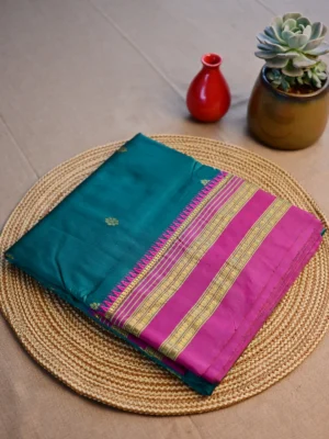 Peacock green pure silk Narayan Peth saree with magenta border.