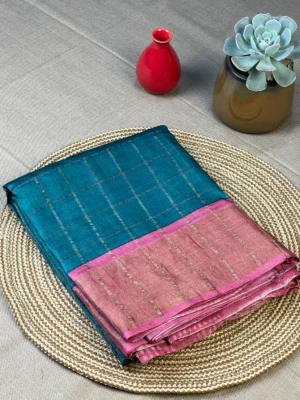 Green pure Tussar silk saree with golden checks and pink border.