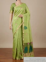 Mannequin wearing mehndi green silk linen saree