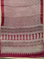Pallu of maroon printed modal saree