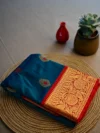 Peacock blue pure Katan silk saree with red border