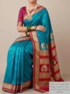 Mannequin wearing peacock blue semi Paithani