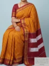 Mannequin wearing yellow cotton Ilkal saree with maroon checks