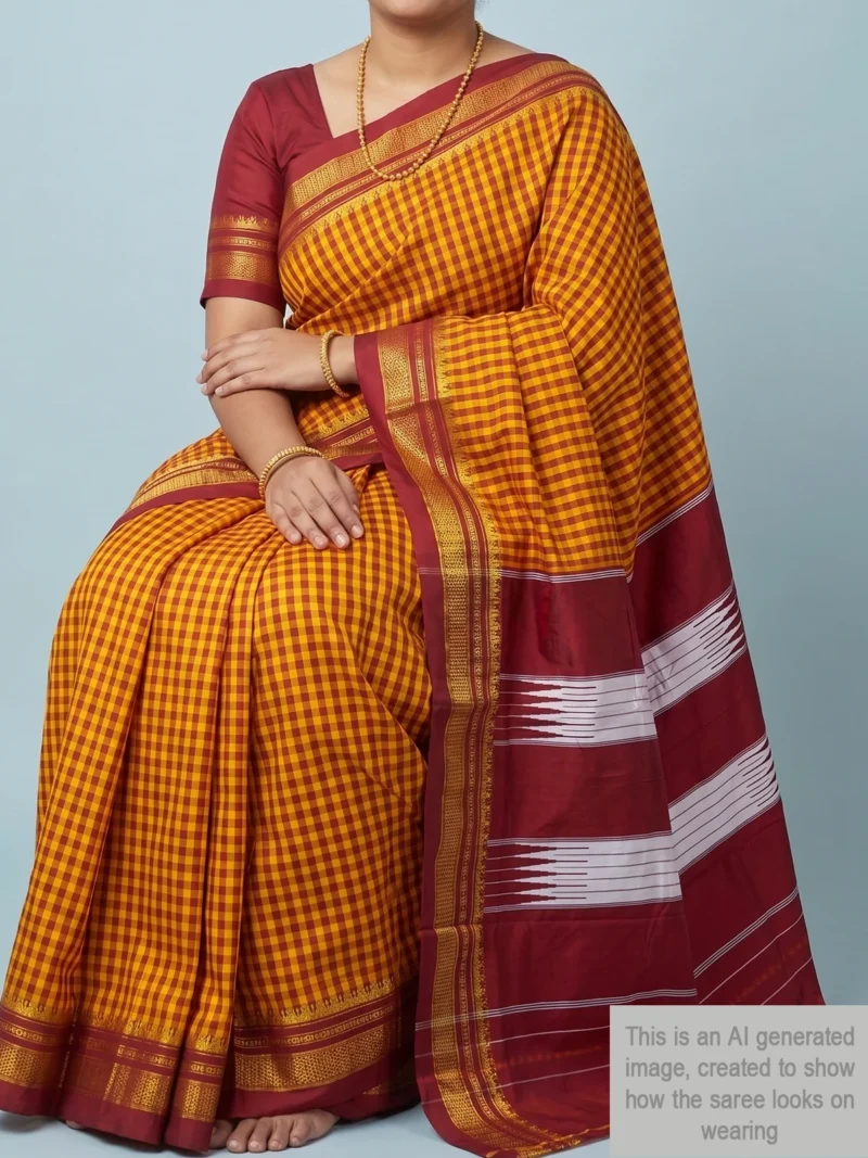 Mannequin wearing yellow cotton Ilkal saree with maroon checks