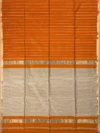 Pallu of orange Maheshwari silk cotton saree with thread lines