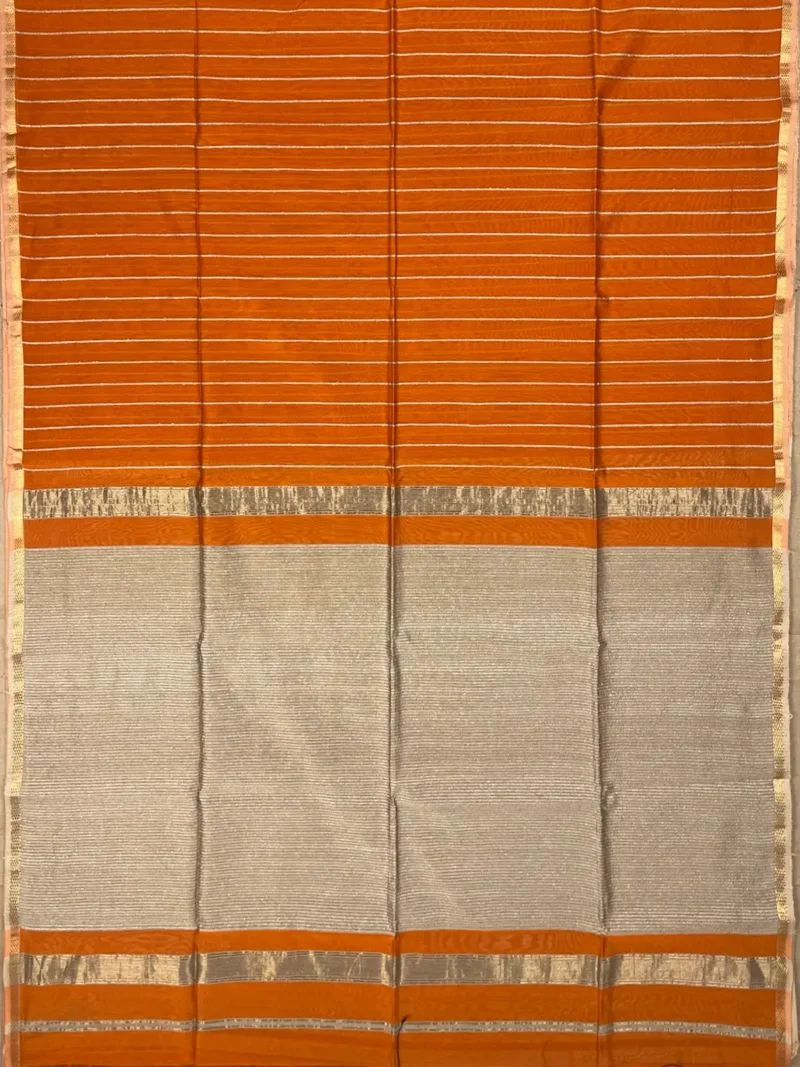 Pallu of orange Maheshwari silk cotton saree with thread lines