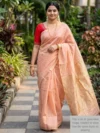 Mannequin wearing peach colour plain tissue-cotton Maheshwari saree