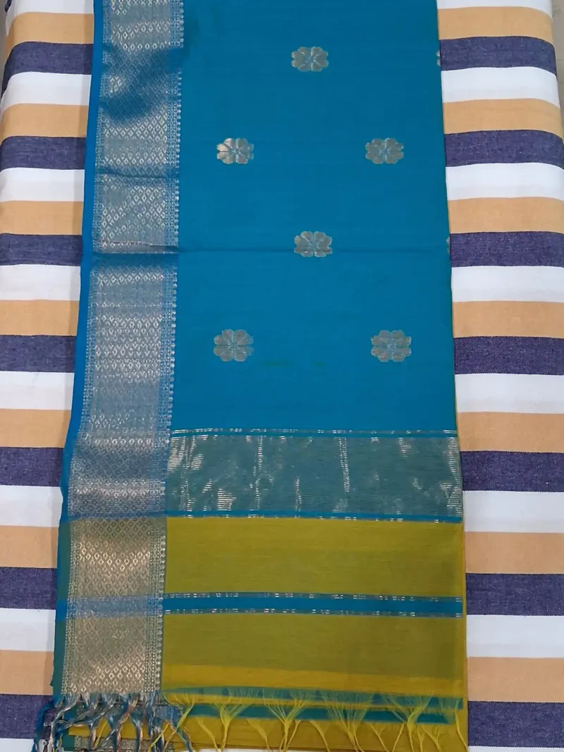 Pallu of Mustard yellow silk-cotton Maheshwari saree with flower butti and contrast pallu