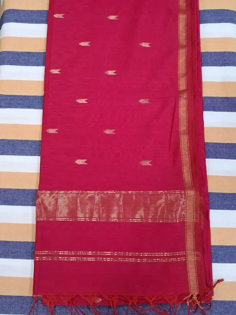Pallu of Rani pink silk-cotton Maheshwari saree with small butti and narrow border